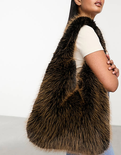 Urbancode tipped faux fur bag in chocolate brown | ASOS
