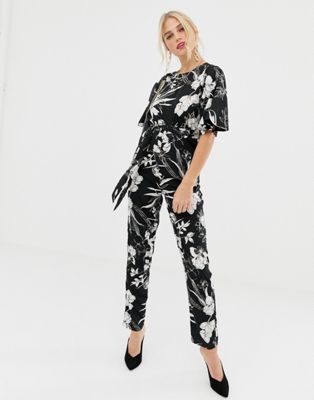 Uttam Boutique - Zwart-wit jumpsuit met korte mouwen en bloemenprint