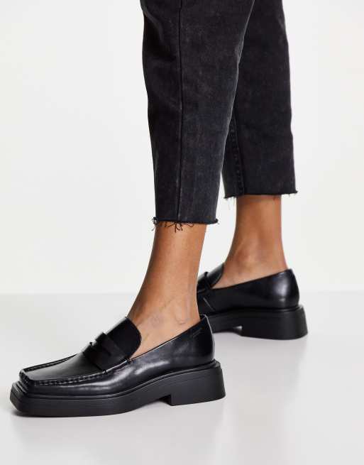 Vagabond black leather pull on penny loafers with square toe and chunky smooth sole. 