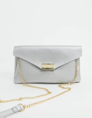 beige clutch bag with chain