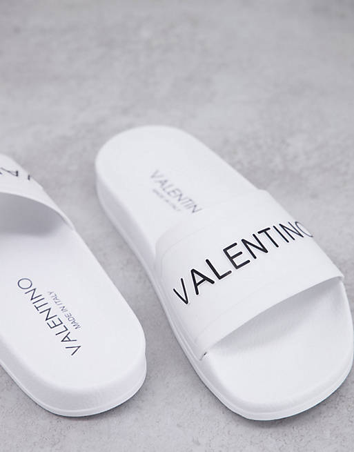 Valentino Shoes logo slides in white