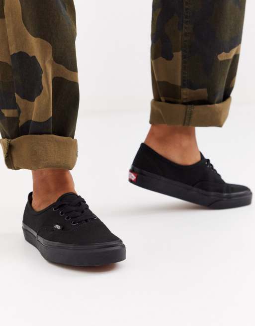 All black vans hot sale on feet