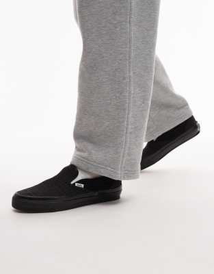Vans Classic LX houndstooth slip on sneakers in black and white