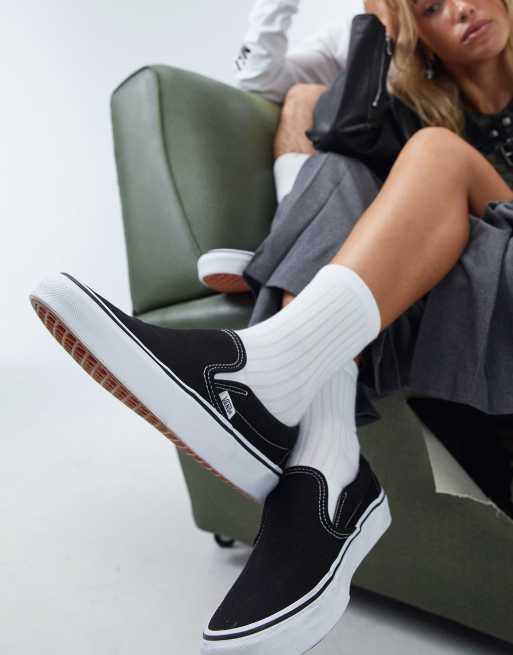 Vans Classic Slip-On canvas sneakers in black and white