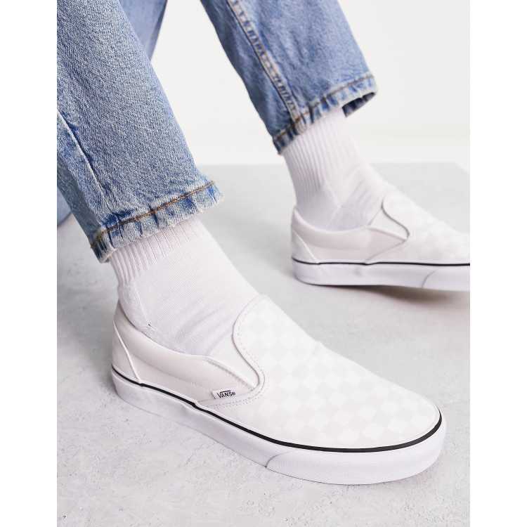 White slip on store checkered vans