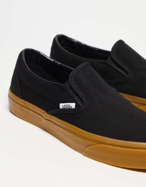 Vans black sole hot sale slip on