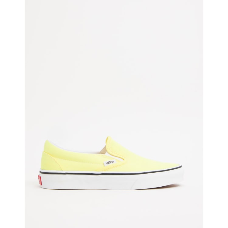 Bright yellow shop vans slip ons