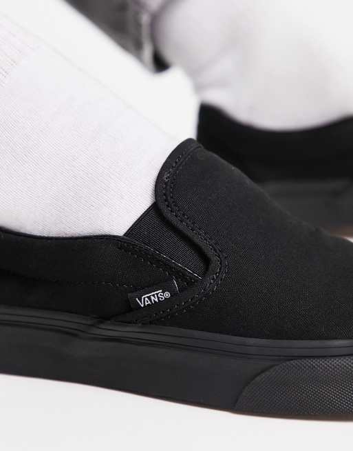 Vans black sole outlet slip on