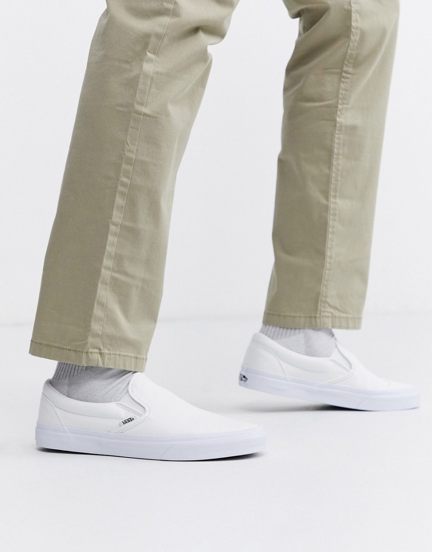 Shop Vans Classic Slip-on Sneakers In White