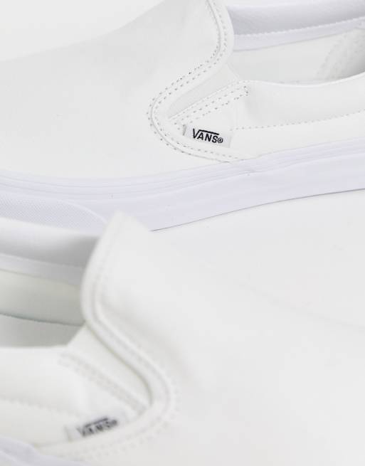 White slip on vans junior sale