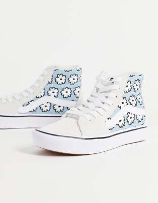 white and blue high top vans