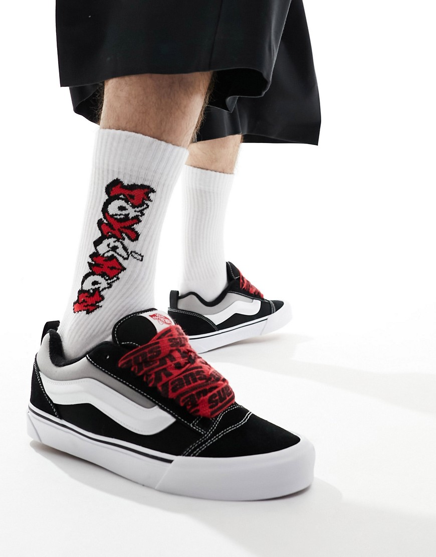 Knu Skool sneakers with red interest laces in black and white