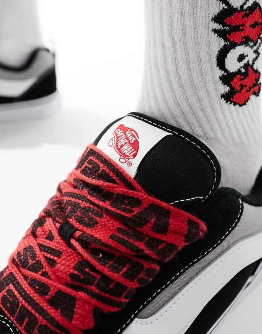 Black and white 2025 vans with red laces