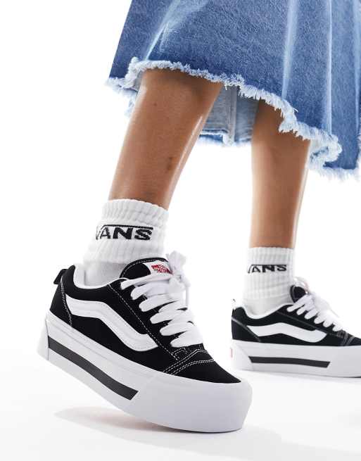 White and store black platform vans