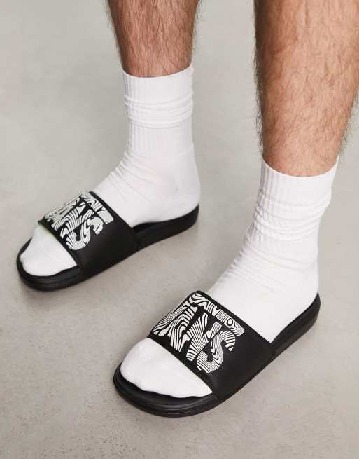 Vans - La Costa - Slippers in zwart met psychedelische print