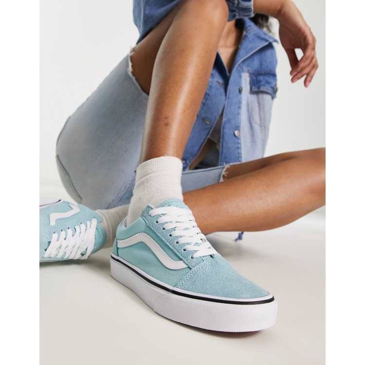 Light blue store and white vans