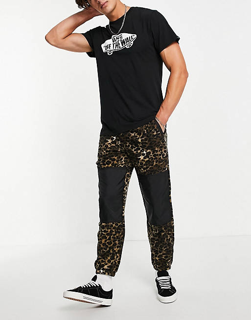 Vans polar fleece trousers in leopard print