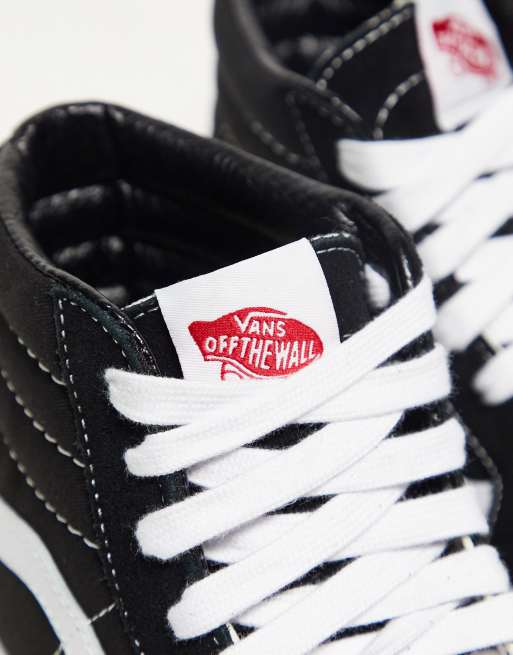 Vans montante noir online et blanche