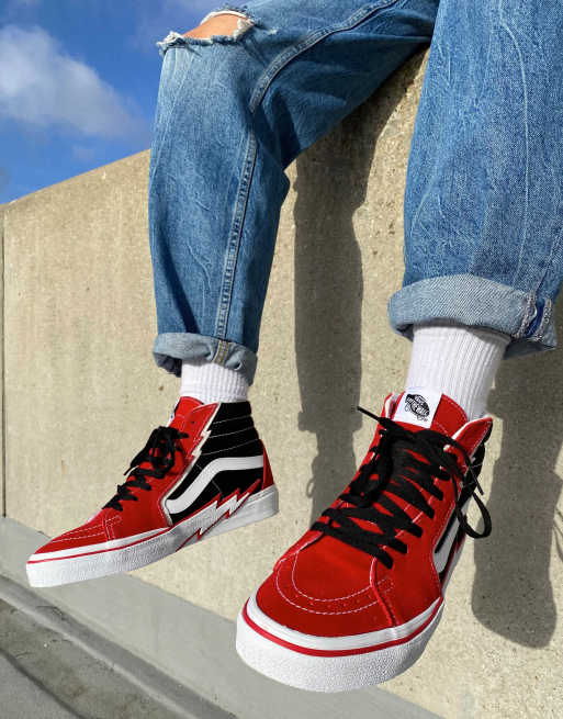 All red high shop top vans on feet