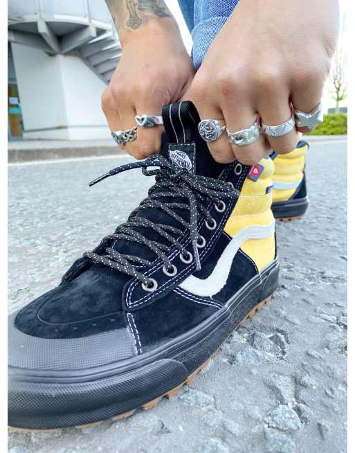 Black and yellow shop high top vans