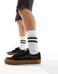 Vans SK8-Low sneakers in black with gum sole