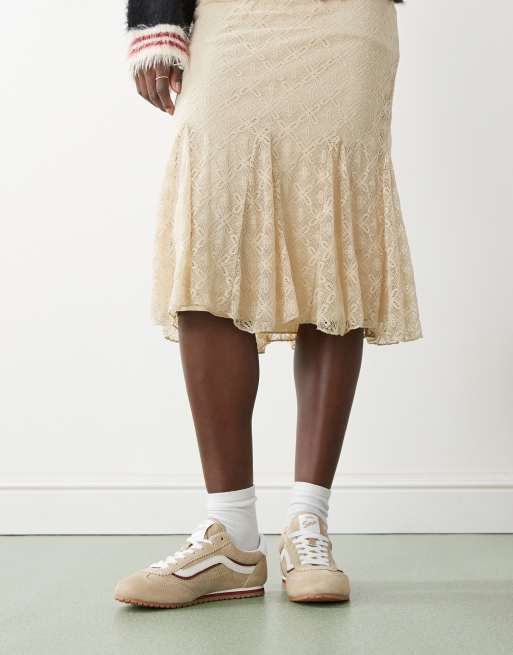 Vans Super Lowpro sneakers in beige and white