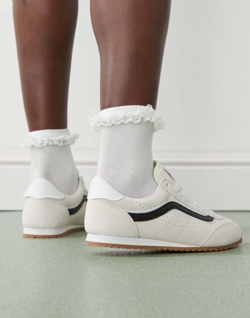 Vans Super Lowpro sneakers in white and black