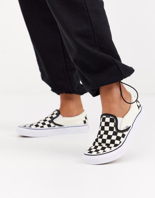 Vans – Svarta och vita, schackrutiga sneakers i loafermodell  