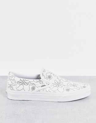 white camo vans slip on