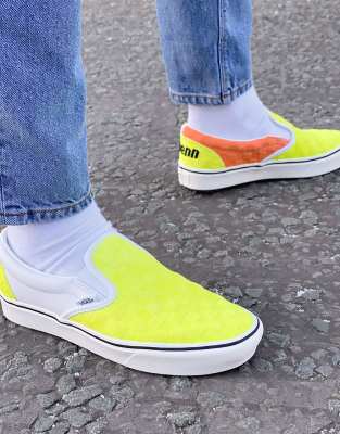 white and yellow slip on vans