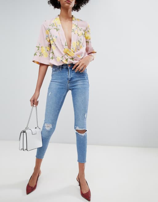 Vaqueros ajustados con lavado medio, rotos y bordes sin rematar Molly de River Island