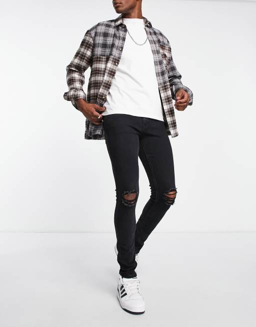 Vaqueros ajustados con lavado negro y abrasiones de corte pitillo de Jack & Jones Intelligence