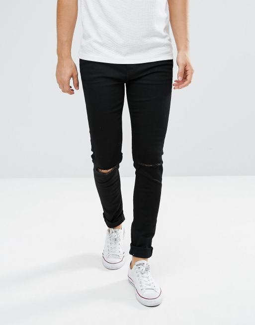 Pantalon negro roto en la online rodilla