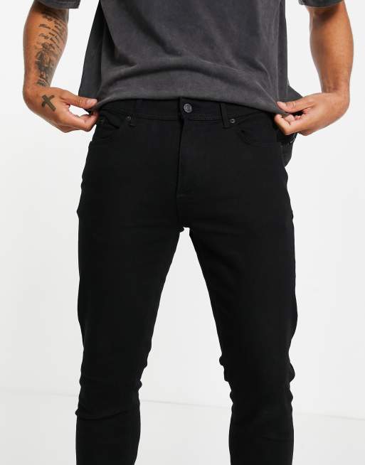 Vaqueros ajustados en negro de River Island, 2 de 4