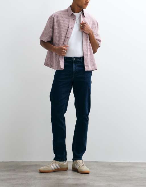 Vaqueros añil de corte slim elástico de ASOS DESIGN, 5 de 5