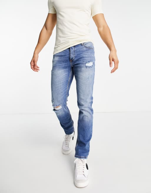 Vaqueros azul claro rasgados de corte slim de River Island