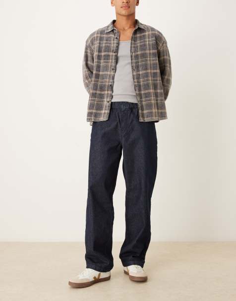 Vaqueros azul crudo holgados con cintura elástica y cordón ajustable en el interior de ASOS DESIGN - view 1