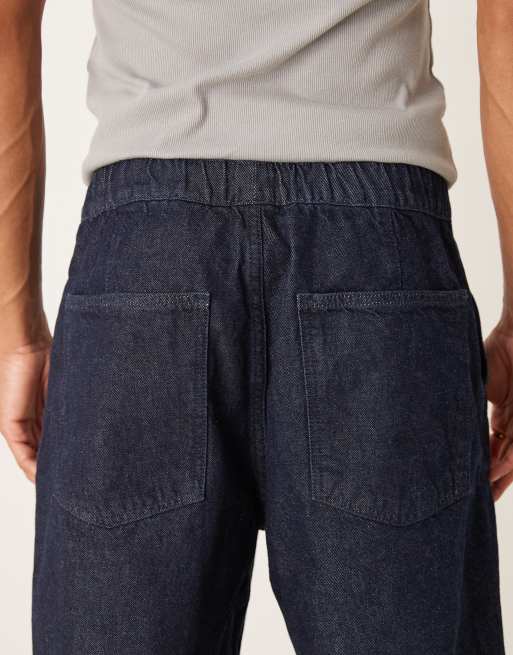 Vaqueros azul crudo holgados con cintura elástica y cordón ajustable en el interior de ASOS DESIGN, 4 de 5