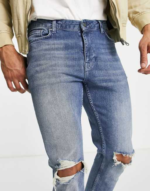 Vaqueros azul medio de corte pitillo con rodillas rasgadas y bajos sin rematar de ASOS DESIGN , 4 de 4