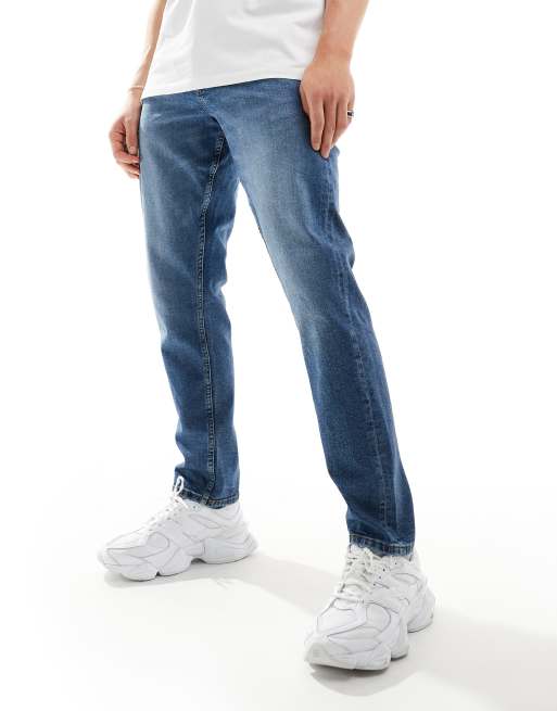 Vaqueros azul medio de corte slim de ASOS DESIGN