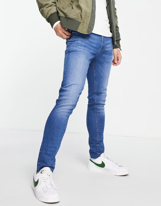 Vaqueros azules de corte pitillo con bajos sin rematar de River Island