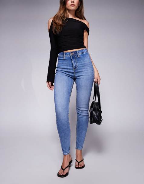 Vaqueros azules de corte pitillo y talle alto con lavado medio de River Island - view 1
