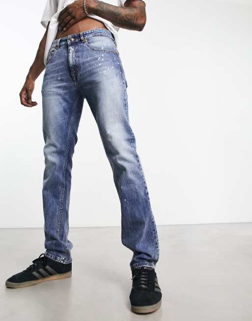 Vaqueros azules de corte slim con diseño desgastado de Versace Jeans Couture