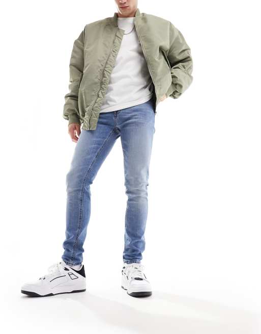 Vaqueros azules de corte slim con lavado tintado medio de ASOS DESIGN
