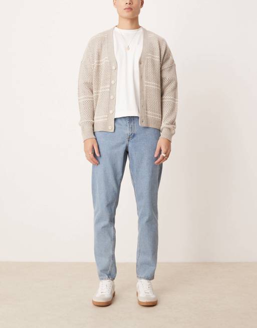 Vaqueros azules de corte tapered con lavado medio de ASOS DESIGN  