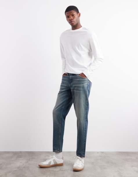Vaqueros azules de corte tapered con lavado medio y acabado tintado de ASOS DESIGN - view 1