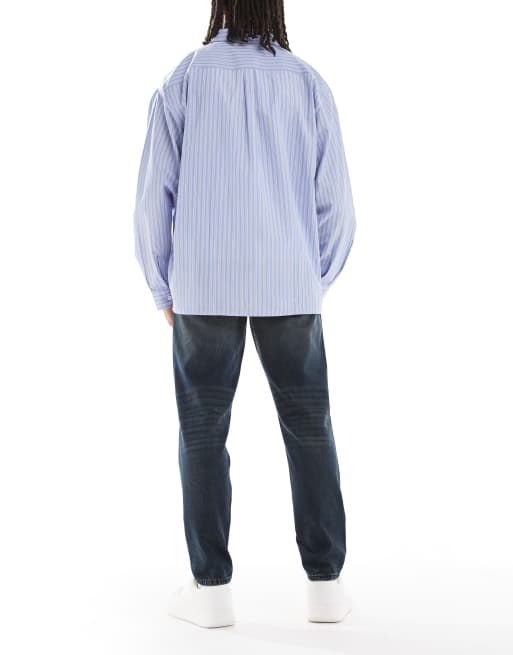 Vaqueros azules de corte tapered con lavado oscuro de ASOS DESIGN, 2 de 5