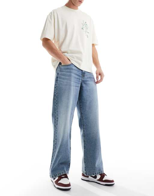 Vaqueros azules holgados con bajos amplios y lavado medio de ASOS DESIGN, 2 de 5