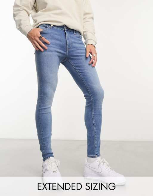 Vaqueros azules superelásticos con lavado medio de ASOS DESIGN