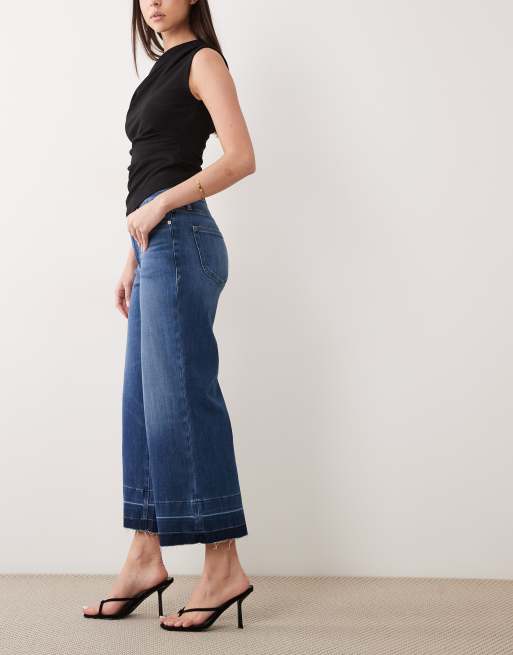Vaqueros capri azules de corte palazzo con lavado medio Soft Tech Good Waist de Good American, 2 de 5